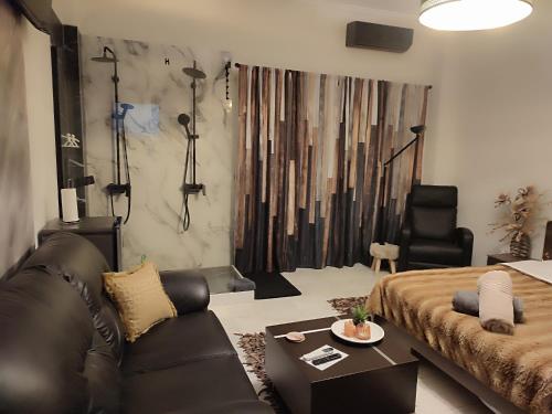 a living room with a couch and a table at ViP in Veria