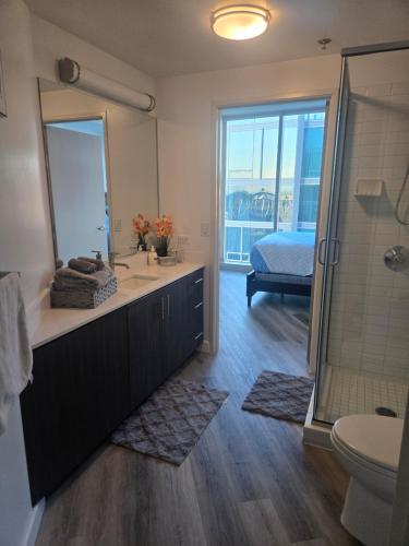 a bathroom with a sink and a shower and a toilet at 2 Bedroom with City Views in Los Angeles