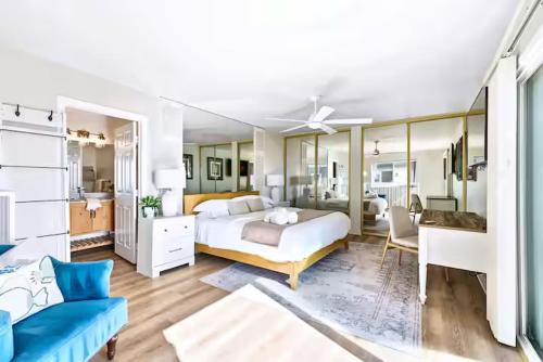a large bedroom with a bed and a bathroom at Beachfront Resort-sunset views deck & luxe king in Oceanside