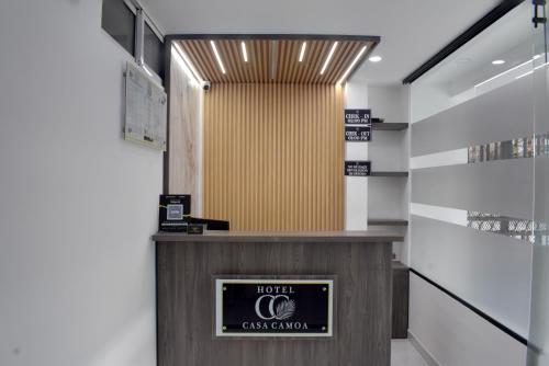 a lobby of a casablanca store with a sign at Hotel Casa Camoa in Villavicencio