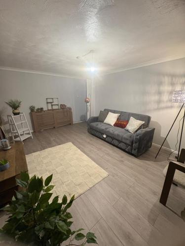 a living room with a couch in a room at Jayden residence and suites in Thornaby on Tees