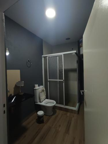 a bathroom with a toilet and a walk in shower at Residencia Dos Soles 2.0 in Resistencia