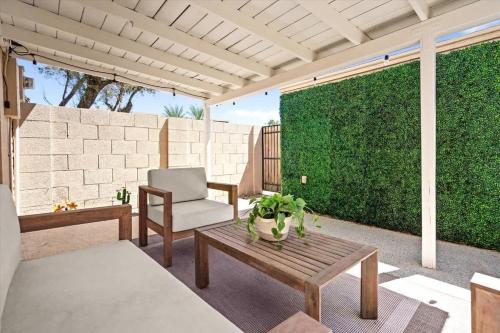 a patio with a couch and a chair and a table at Old Town Elegance in Scottsdale