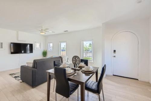 a living room with a table and a couch at Cosmopolitan Cottage in Phoenix
