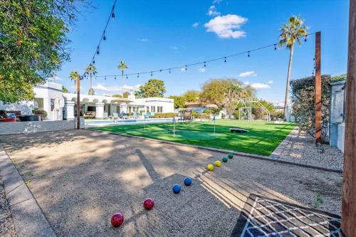 a backyard with a golf course with balls on the ground at Live Blissfully in Phoenix