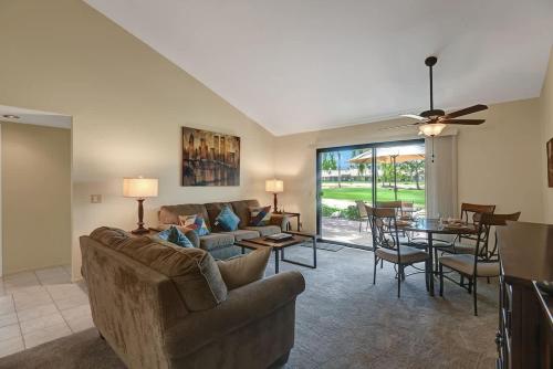 a living room with a couch and a table at PN561 - Jupiter View - Alice Lodging in Palm Desert