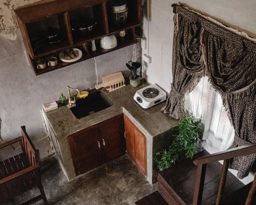 a kitchen with a sink and a counter top at Hayag in General Luna