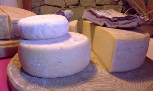 two slices of cheese sitting on top of each other at Agritur Bontempelli in Pellizzano