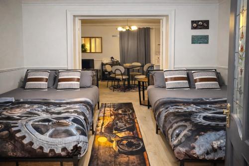 a room with two beds and a dining room at Gra accommodations athy in Athy