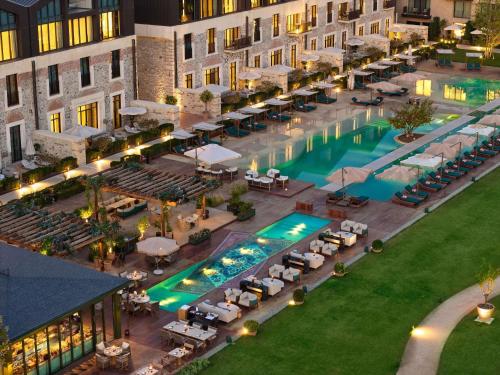 an aerial view of a hotel with a swimming pool at Aliée Istanbul - A Paris Society Collection Hotel in Istanbul