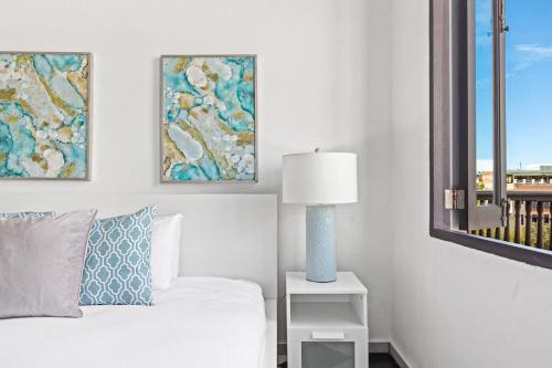 a white bedroom with a bed and a window at Mint Suite - 1 BR in Old San Juan in San Juan