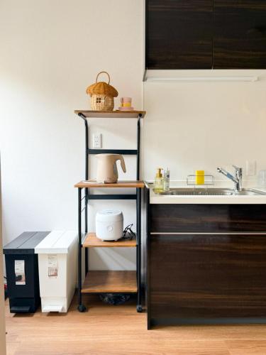 Wakyo Kujo 3 min walk from Kujo Station, 4 rooms for 8 people, Free parking, Balcony, Laundry and drying, Direct access to USJ, Namba and Kyocera Dome