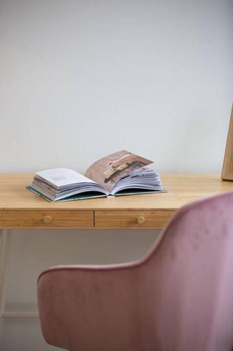 an open book sitting on top of a desk at The Rocks Resort Unit 2C in Gold Coast