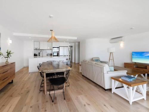 a living room with a couch and a table at The Rocks Resort Unit 8G in Gold Coast