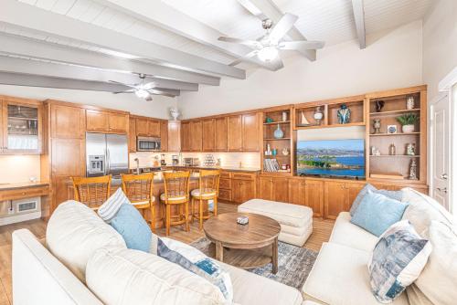 a living room with a couch and a table at Charming 2Br Condo W Ac, Steps To Beach And Balboa Pier By Beachview Rentals in Newport Beach