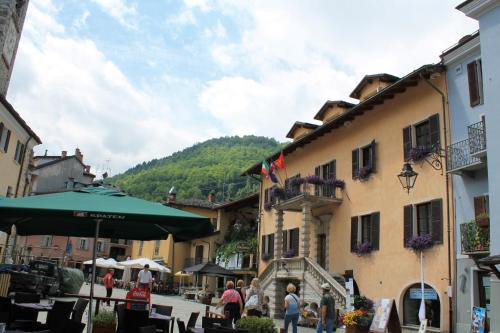 a group of people walking down a street in a town at Casa Rivalta by Holiday World in Limone Piemonte