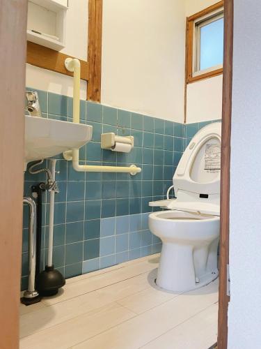 a bathroom with a toilet and a sink at 大阪小林民宿開啟您的夢幻之旅 in Osaka