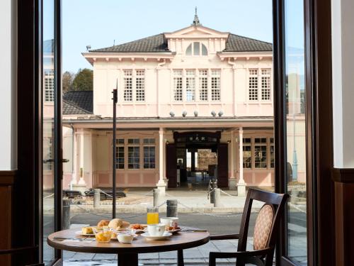 a table with food on it in front of a building at Nikko Station Hotel Classic in Nikko