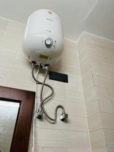 a light on the wall of a bathroom at Scenic Lanka rooms in Dehiwala