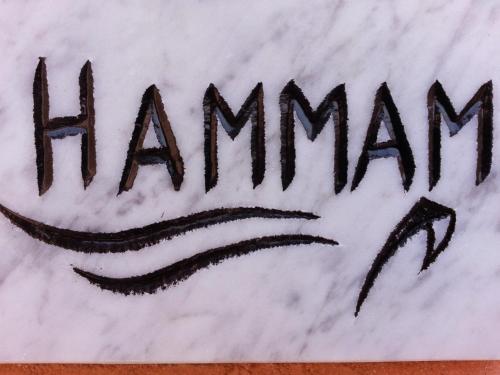a sign with the word amazon written on it at Les Bains de Fez Tara in Fès