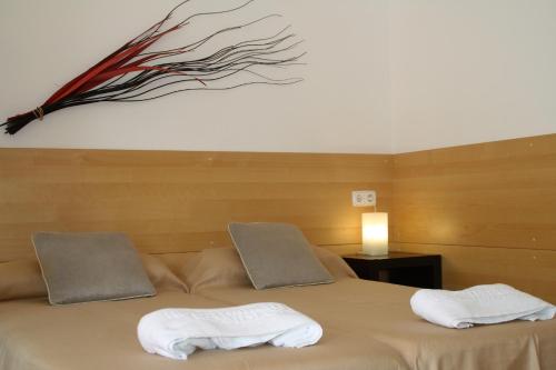 Postel nebo postele na pokoji v ubytování Apartaments Margarita Sabina Pinell