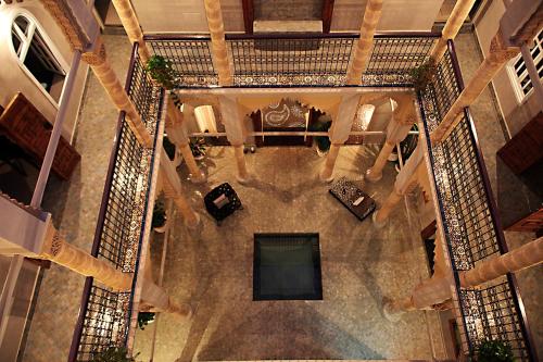 an overhead view of a lobby with a table and chairs at L'Alcazar in Rabat