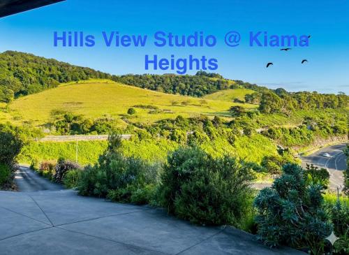 a view of a hill with trees and a road at Hills View Studio Kiama Heights in Kiama