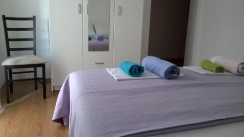 a bed with two pillows on top of it at Sobe BCRNJAC in Međugorje