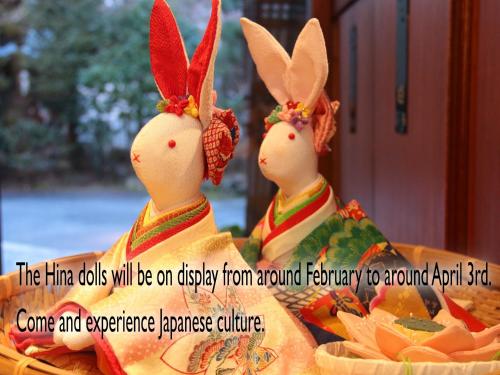 two wooden bunnies sitting next to each other at Ena Totaro in Ena