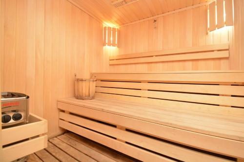 a sauna with wood paneling and a wooden floor at Homma Aparan with Superpool, 30 min from Yerevan in Aparan