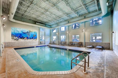 a large swimming pool in a large room at Tidewater Beach Resort by Panhandle Getaways in Panama City Beach