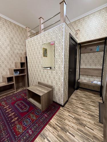 a room with a bench and a mirror on a wall at Zahid Inn in Tashkent
