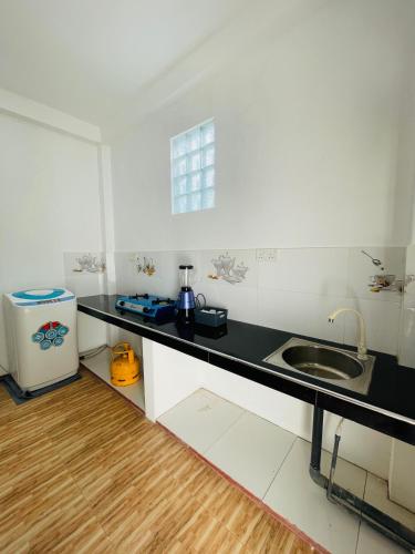 a kitchen with a sink and a counter top at SH Villa in Weligama