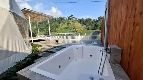 a white bath tub sitting on top of a house at Sangkuriang 2 - Private Dome in Bandung