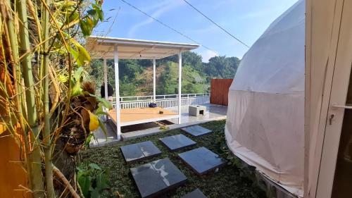a view of a garden with a gazebo at Sangkuriang 2 - Private Dome in Bandung