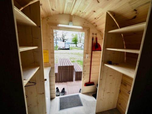 a small house with an archway in the middle at Camping Willam in Reichenau