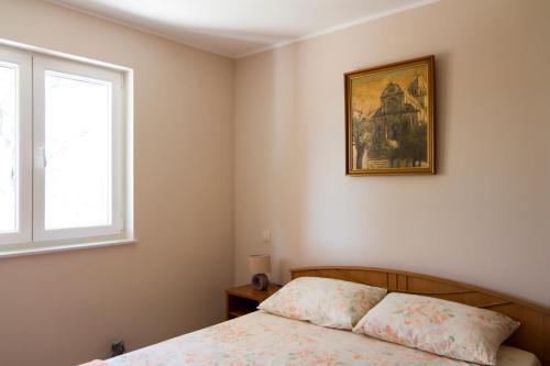 Llit o llits en una habitació de Modrika Apartments