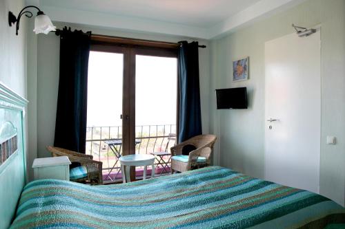 מיטה או מיטות בחדר ב-L'isola Guesthouse