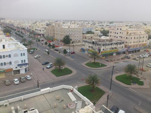 an aerial view of a street in a city at Husin Al Khaleej Hotel Apartment in Seeb