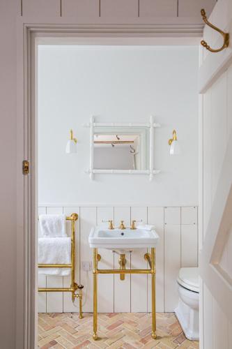 a bathroom with a sink and a toilet at Number One Bruton in Bruton