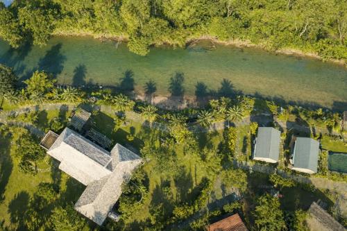 an aerial view of a house next to a river at Orchid Villa & Homestay Farm Lăng Cô in Thôn An Cư Ðông