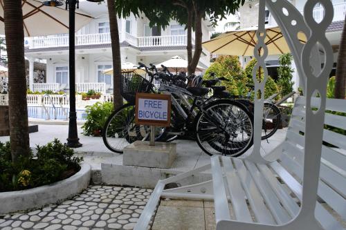 a group of bikes parked next to a free house at Godiva Villa Phu Quoc in Phu Quoc