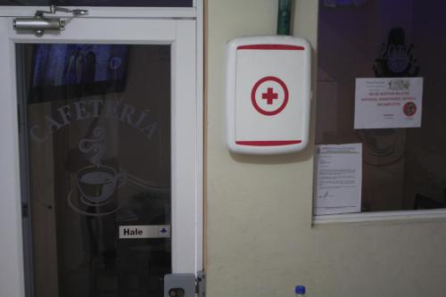 a door with a iphone sign next to a window at Hostal Rosa Mar in Manta