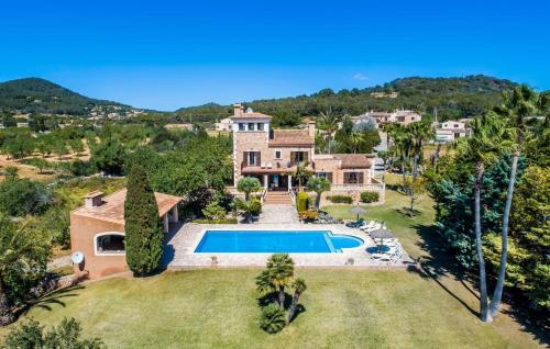 an aerial view of a house with a swimming pool at Can Palleta Nou in S'Horta