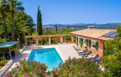 a villa with a swimming pool and a house at Santa Maria in Artá