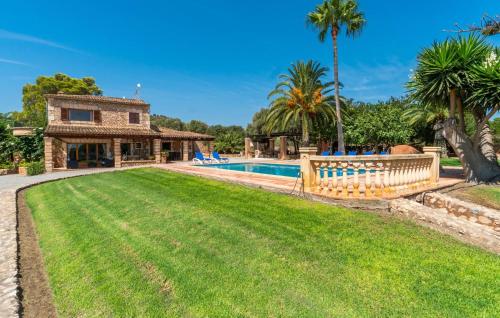 an image of a villa with a swimming pool at Bosco in Sa Coma