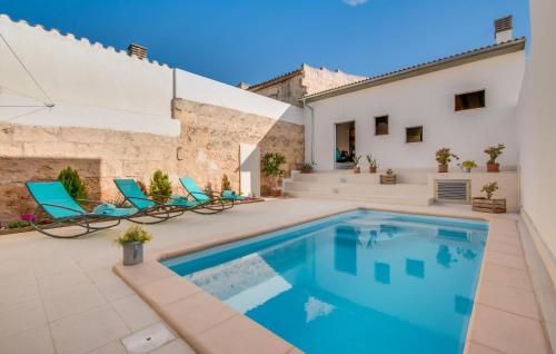 a villa with a swimming pool and a house at Foners Mallorquins in Muro