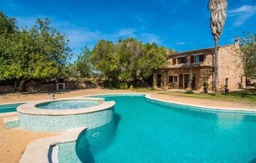 a swimming pool in front of a house at Mirabo Ramonet in Felanitx