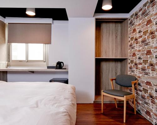 Postel nebo postele na pokoji v ubytování Bon Hotel Taipei