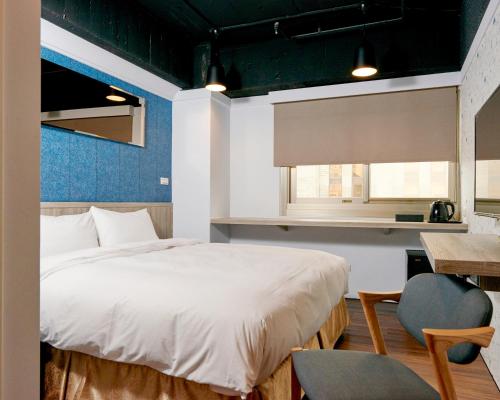 Postel nebo postele na pokoji v ubytování Bon Hotel Taipei